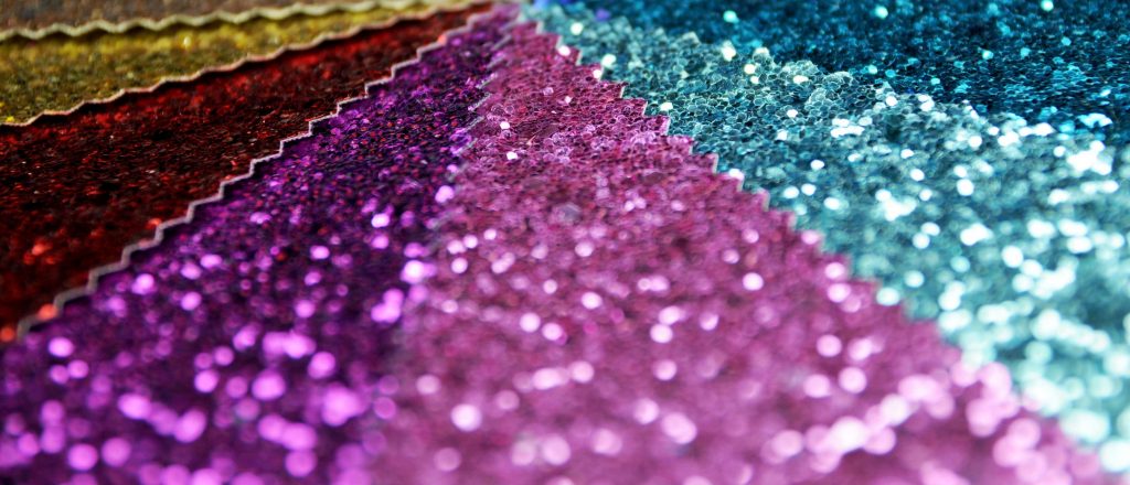 samples of coloured glitter fabric