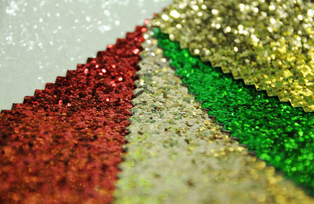 Christmas colours red green gold white glitter fabric for display